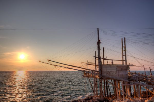 A night view of a typical trabucco, an apulian wooden construction for fishing by a system of nets